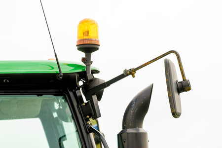Close of detailed tractor round lights with bulbs. Headlight lamp on truck.