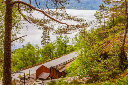 Staircase to walk up to Svandalsfossen in Norway, waterfall in norwegian mountains. National tourist...