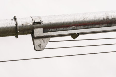 Close up of metal rope hooked on the reel, detail industrial agricultural objects