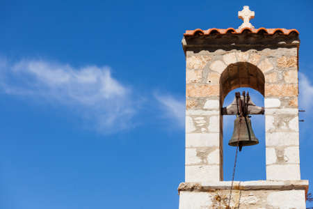 Detail of architecture stone traditional belfry bell tower in Vathia old town, Mani Peloponnese Greece. Architectural theme.の写真素材