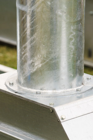 Close up of metal, steel pipe in agricultural machine vahicle. Industrial details