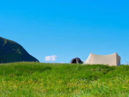 Camping. Tent on nature in summer. Lofoten archipelago Norway. Holidays and travel.の写真素材