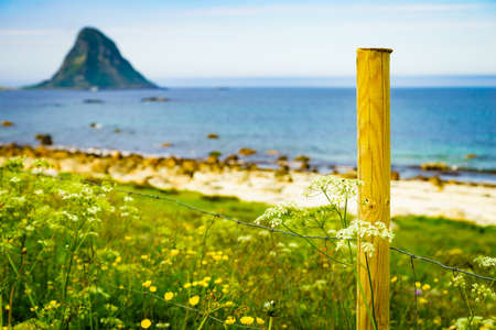 Seascape, sea coast with sandy beach and island Bleiksoya in the distance, resort Bleik Andoya Norway. Vesteralen archipelago.の写真素材