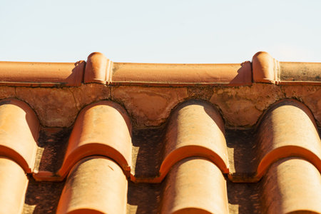 Red tiles roof texture architecture background, detail of house close up detail.