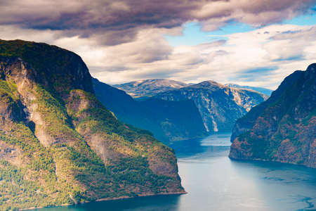 Amazing dramatic view of the fjords and mountains. Aurlandsfjord fjord landscape in Norway Scandinavia. National tourist road known as The snow road.の写真素材