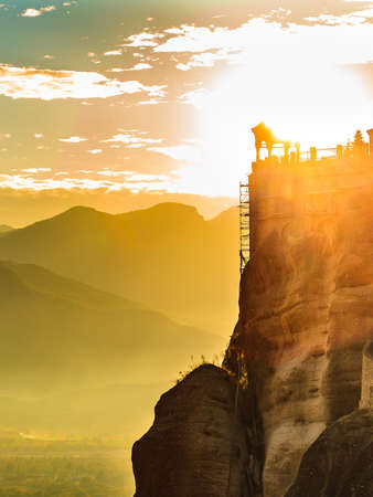 Scenic sunset evening sky over holy Varlaam monastery on cliff in Meteora, Thessaly Greece. Greek destinationsのeditorial素材