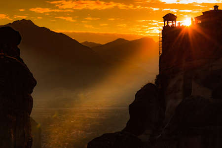 Scenic sunset evening sky over holy Varlaam monastery on cliff in Meteora, Thessaly Greece. Greek destinationsの写真素材
