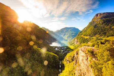 Fjord Geirangerfjord with cruise ship at sunset, view from Flydalsjuvet viewing point, Norway. Travel destinationの写真素材