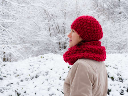 Adult woman walking in winter forest. Snowy nature landscape. Activity relax on fresh air concept.の写真素材
