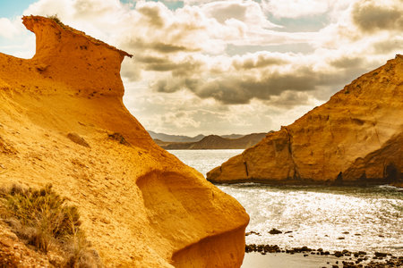 Cocedores Beach with yellow sand formations at Mediterranean sea, Murcia region Spain.