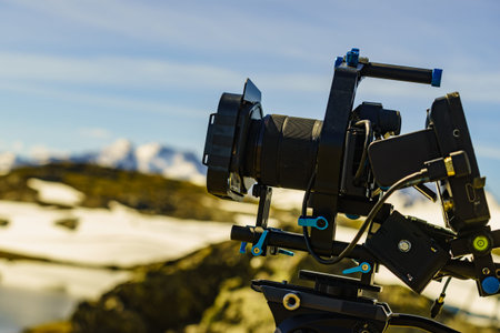 Tourism holidays pictures and traveling. Professional camera on tripod taking photo from Sognefjellet mountains landscape, Norway Scandinavia.の写真素材