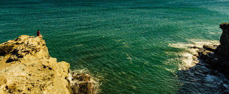 Tourist woman on spanish rocky coastline in Murcia region. Mediterranean Sea coast landscape,...