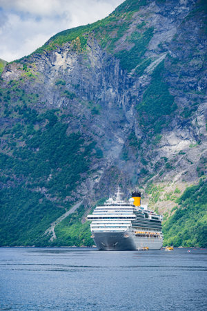 Fjord Geirangerfjord with ferry boat, Norway. Travel cruising.の写真素材