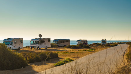 SANTA POLA, SPAIN - MARCH 3, 2019: Camper vehicles camping on mediterranean coast of seaside spanish...