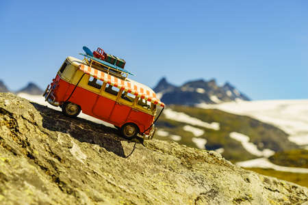 SOGNEFJELLET, NORWAY - JULY 7, 2018: Miniature scale model hippy VW van in norwegian mountains, tourist route Sognefjellet, the highest mountain road in Northern Europeのeditorial素材