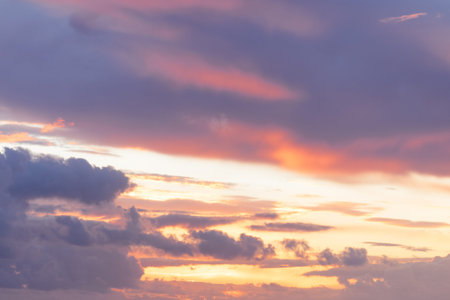 Beautiful sunset in warm colors of purple, orange and yellow. Beauty of nature conceptの写真素材