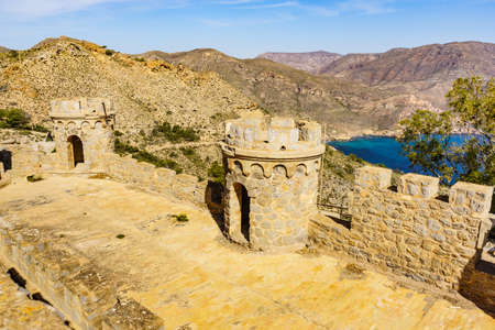 Tourist destination. Battery de Castillitos in Spain Cartagena, Cabo Tinoso. Fortifications facade imitating medieval castle. Defensive architecture.の写真素材