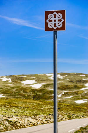 AURLANDSFJELLET, NORWAY - JUNE 27, 2018: The Norwegian Scenic Routes trademark logo sign at Aurlandsfjellet tourist route in region between Aurland and Laerdal.のeditorial素材