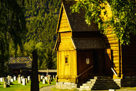 LOM, NORWAY - JULY 7, 2018: Graveyard with old tombstones around Lom Stave Church in Oppland county, Norway.のeditorial素材