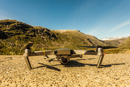 SOGNEFJELLET, NORWAY - JULY 7, 2018: DJI Drone Mavic Pro Platinum starting from roadside at Sognefjellet route. DJI is the world leader in commercial and civilian drone industry,のeditorial素材