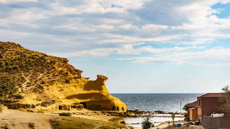 Cocedores Beach with yellow sand formations at Mediterranean sea, Murcia region Spain.