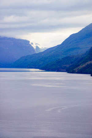 Norwegian landscape. Green mountains hills and fjord Saudafjord on overcast weather. National...