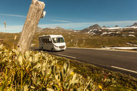 SOGNEFJELLET, NORWAY - JULY 7, 2018: Camper car Pilote model drive in mountains on National Tourist Route Sognefjellet.のeditorial素材