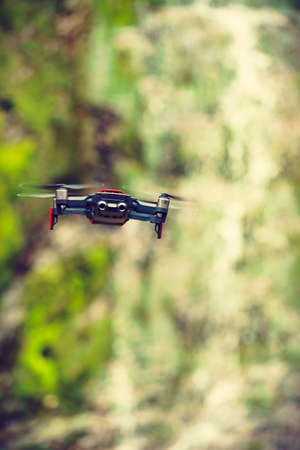 SVANDALFOSSEN, NORWAY - JUNE 23, 2018: Red DJI Drone Mavic Air, tourist route Ryfylke Rv13. Technological equipment.のeditorial素材