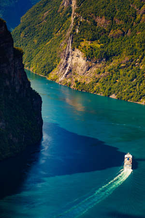Fjord Geirangerfjord with big cruise ship, view from Ornesvingen viewing point, Norway. Travel destinationの写真素材
