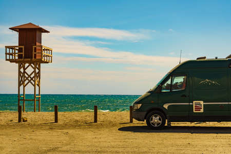 Camper car on Quitapellejos Beach, Andalucia region in Spain. Traveling and adventure in motor home. Summer holidaysの写真素材