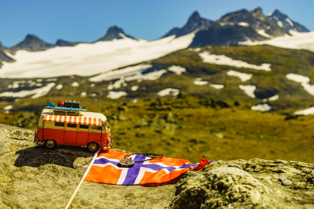 SOGNEFJELLET, NORWAY - JULY 7, 2018: Miniature scale model hippy VW van in mountains on National tourist scenic route 55 Sognefjellet.のeditorial素材