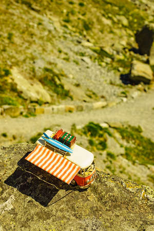 SOGNEFJELLET, NORWAY - JULY 7, 2018: Miniature scale model hippy VW van in norwegian mountains, tourist route Sognefjellet, the highest mountain road in Northern Europeのeditorial素材