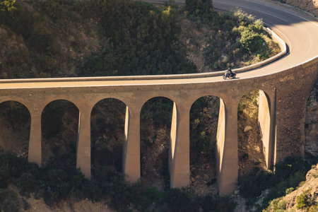View from Granatilla Carboneras Viewpoint of hilly landscape, curved road and large viaduct. Cabo de...
