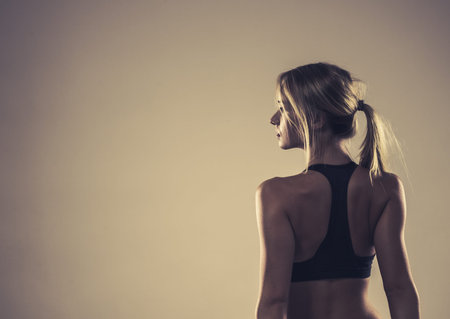Sport, training, gym and lifestyle concept. Woman in sporstwear black bra doing fitness exercises