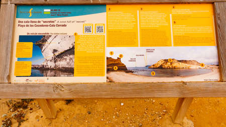 COCEDORES BEACH, SPAIN - MARCH 19, 2019: Cocedores Beach with information board, Murcia region Spain.のeditorial素材