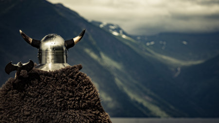 Viking warrior with helmet and ax on fjord shore in Norway. Tourism and traveling conceptの写真素材