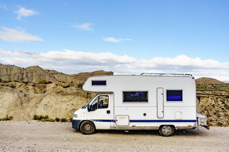 Caravan vehicle camping in Tabernas desert. Almeria province, Andalusia Spain. Traveling in mobile...