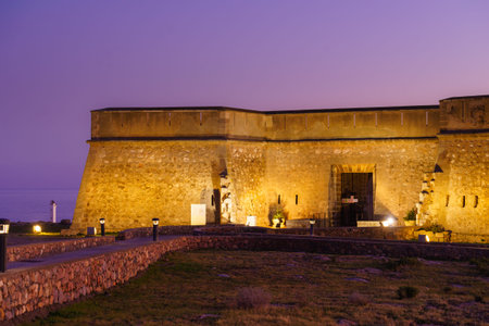 Los Banos de Guardias Viejas, Almeria Spain - January 15, 2020: Coastal fortification, night view of...