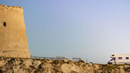 Rv caravan at Mesa Roldan tower. Visiting Cabo de Gata Nijar Natural Park in Almeria province, Andalusia Spain. Tourist attraction, Defense towers.の写真素材