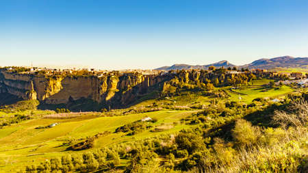 Ronda town and valley, Andalusia, Spain. View from distance. Popular landmark. Tourist attraction, place to visit.の写真素材