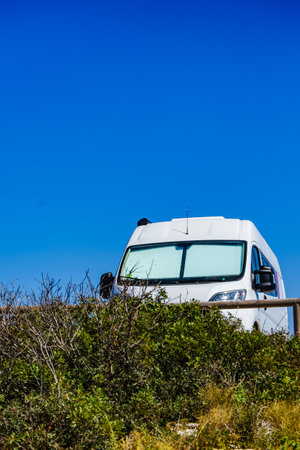 Camper with thermal screen blind at window pane on mediterranean coast in Spain. Camping on nature. Holidays and travel in motor home.の写真素材