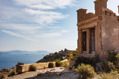 Tourist site. Fortification area Battery de Castillitos in Spain Cartagena, Cabo Tinoso. View from distance with seascape.のeditorial素材