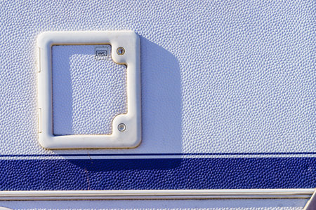 Details of camper car recreation vehicle, toilet exterior service door.の写真素材