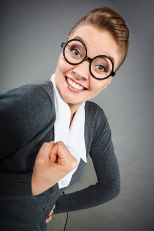 Satisfaction and happiness concept. Happy satisfied relaxed elegant woman enjoy her work. Joyful smiling businesswoman secretary showing victory gesture.の写真素材