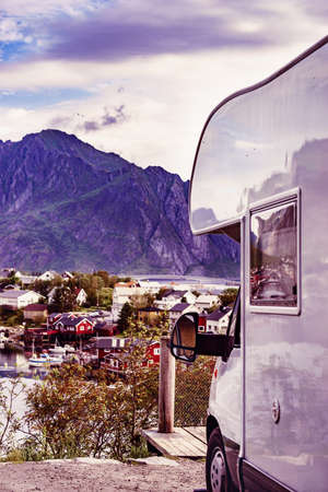 Camper car motor home and fjord landscape with Reine village in summer, Lofoten Norway. Camping on nature. Holidays and travel in caravan.の写真素材