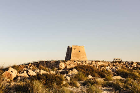 Rv motor home at Mesa Roldan tower. Visiting Cabo de Gata Nijar Natural Park in Almeria province, Andalusia Spain. Carboneras tourist attraction.の写真素材