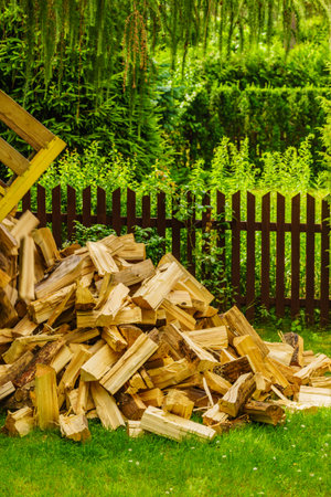 Truck is unloading firewood, throwing out wood logs. Preparation for winter.の写真素材