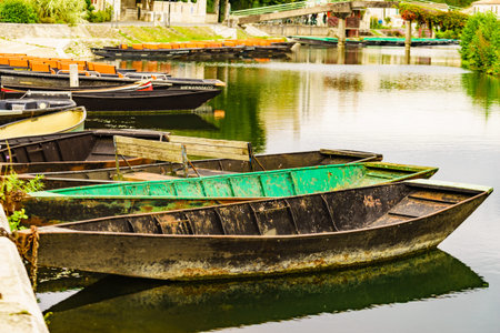Coulon town in France. River view with boats. Deux Sevres, New Aquitaine region. Tourism place