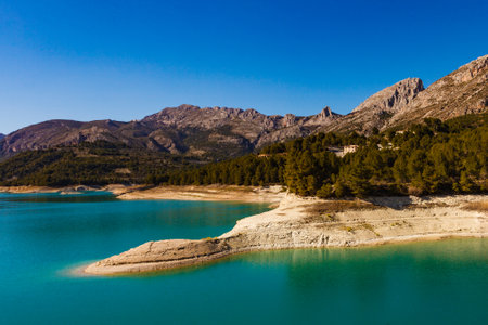 View on Guadalest water reservoir with turquoise water in Alicante province Spainの素材 [FY310170746586]