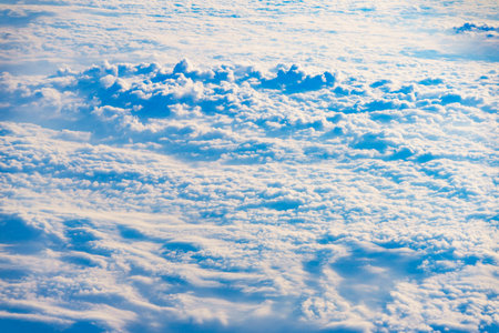 View from airplane window to clouds